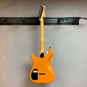 Godin Session R-HT Pro Retro Orange Open Box electric guitar displayed on a wall.