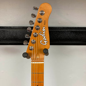 Close-up of the Godin Session T-Pro with Bag headstock, displaying tuning pegs, Godin logo, and part of the fretboard against a plain background.