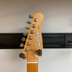 Godin Stadium Pro Ozark Cream MN Electric Guitar close-up showing head with tuning pegs and high-quality pickups.