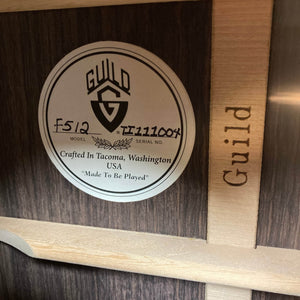 Close-up of a Guild USA F-512 w/OHSC 2005 Circa label, showing model and serial details. Crafted in Tacoma, Washington, the phrase "Made To Be Played" emphasizes this Guild jumbo 12-string's outstanding quality.