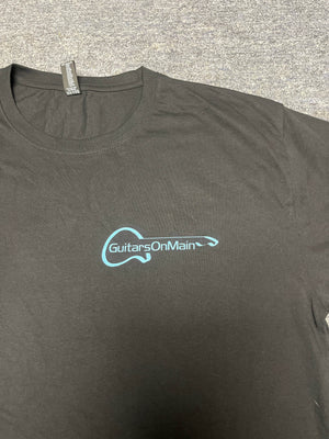 Close-up of Guitars on Main logo on black t-shirt