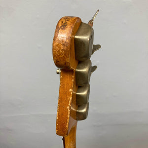 Hagstrom HII-B Mid-1960s red bass headstock, showcasing original closed-gear tuners, emblematic of vintage craftsmanship and unique Scandinavian design.