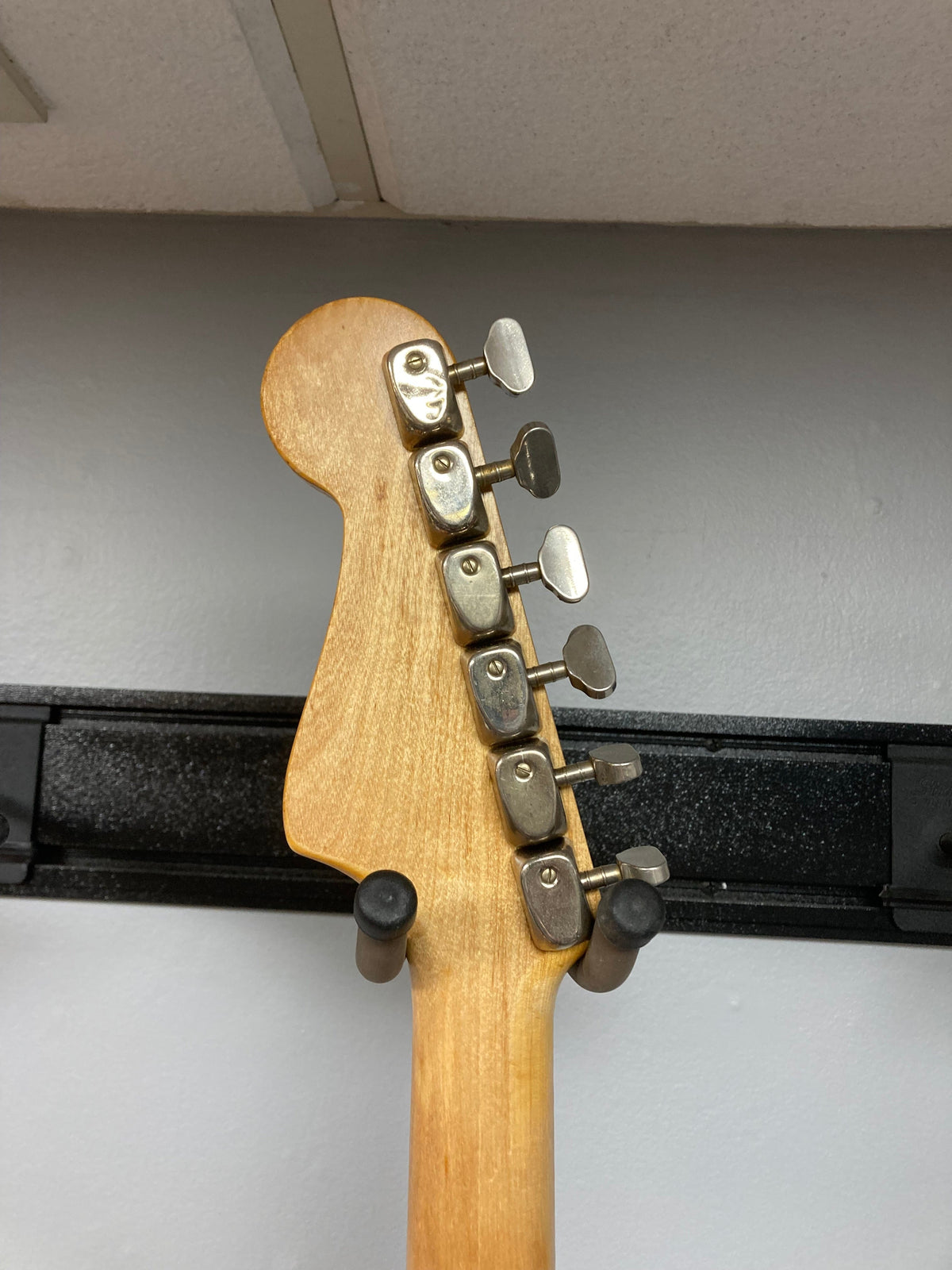 Hagstrom III 1960s Sunburst electric guitar neck with silver pegs, showcasing vintage craftsmanship, available at Guitars on Main.