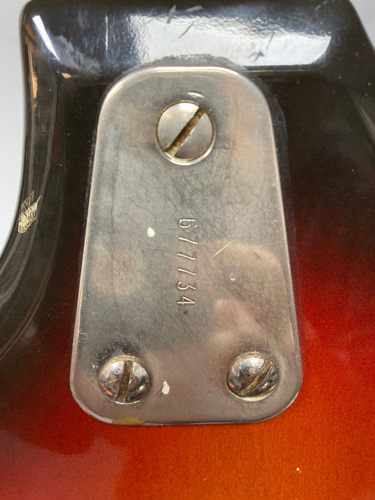 Hagstrom III 1960s Sunburst Electric Guitar with visible metal plate and screws, showcasing vintage craftsmanship and original case.