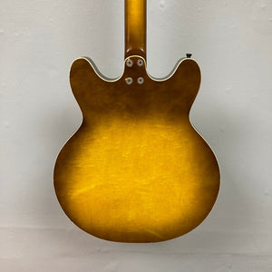 Harmony H-75 1960s Sunburst guitar, close-up showing elegant sunburst finish and minor blemishes on the body.