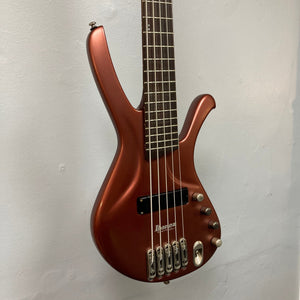 Ibanez Ergodyne Eda 905 5-string bass guitar close-up, showcasing strings, neck, and unique Fishman Piezo Mono-Rail II bridge.