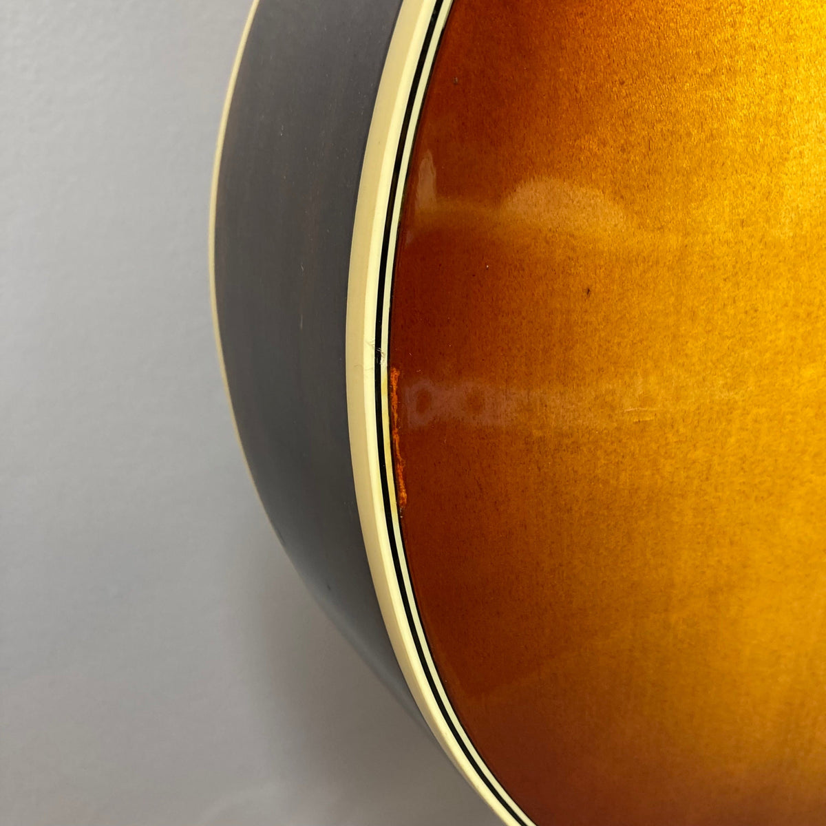 Close-up of an Ibanez Starfield hollow body guitar, highlighting its elegant design and vintage-inspired glossy finish.