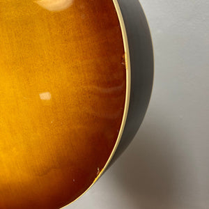 Close-up of the Ibanez Starfield hollow body guitar, showcasing its elegant design and craftsmanship, highlighting the single humbucker neck pickup and control knobs.