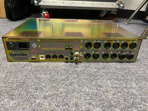 Rear view of a preowned Eventide H8000 Multi-Channel Effects System by Eventide, displaying XLR, MIDI, and power connectors on a carpeted floor.
