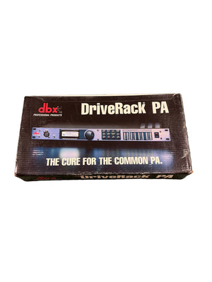 Rectangular box for the dbx DriveRack PA Complete Loudspeaker Management System by dbx, featuring a product image and the slogan "The Cure for the Common PA" on the front.