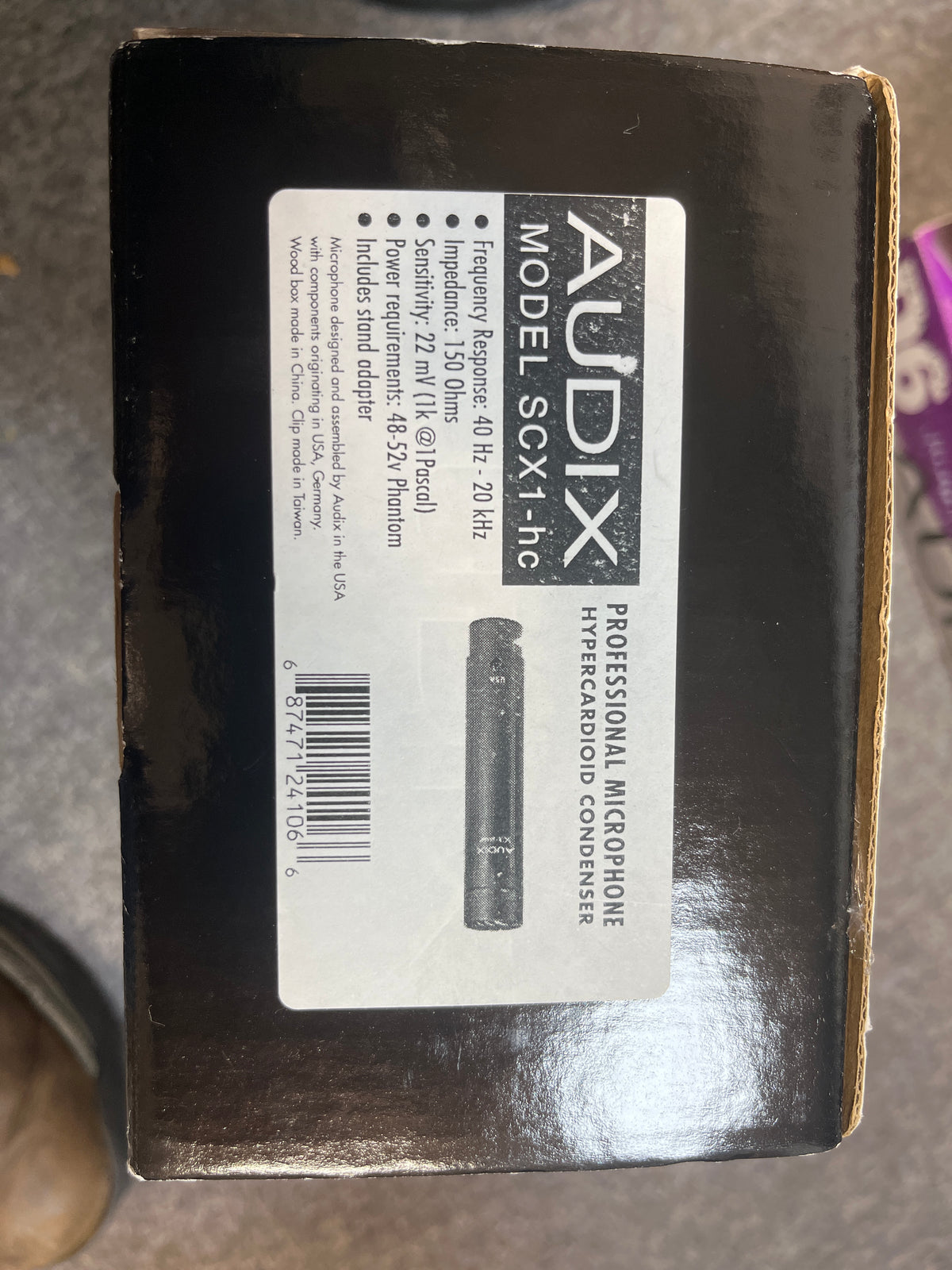 A box labeled "Audix SCX1-hc Professional Hypercardioid Condenser Microphone (Preowned)" displays specs and an image of the Audix SCX1-hc, a hypercardioid condenser mic by Audix ideal for studio use.