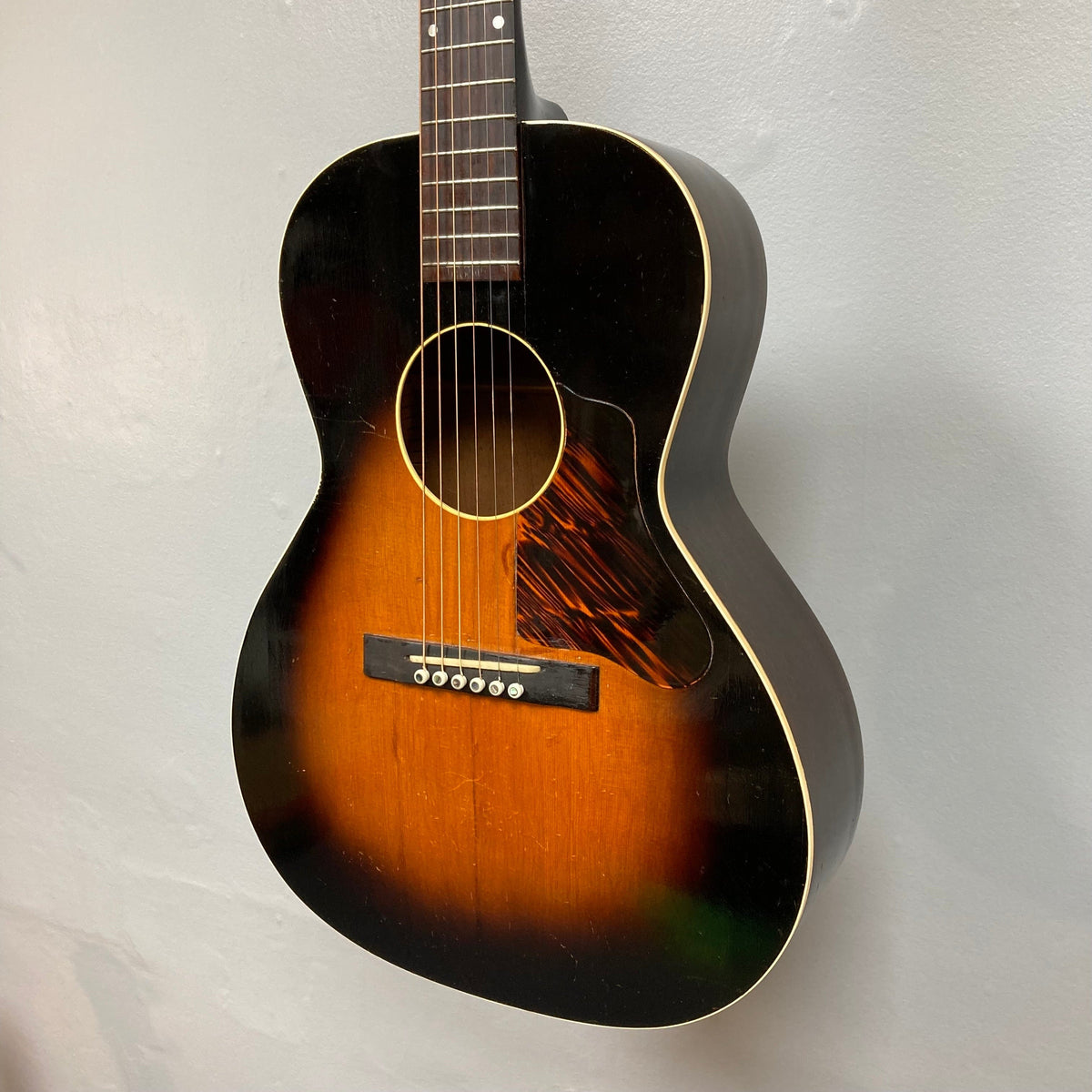 Kalamazoo KG-14 1930s-1940s Sunburst guitar, close-up of strings and body, showcasing vintage charm and expert restoration details.