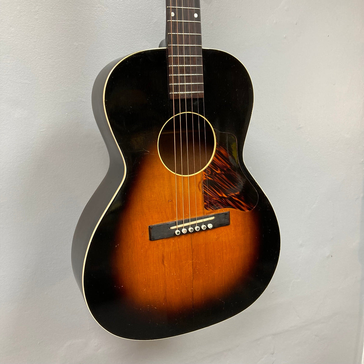 Kalamazoo KG-14 1930s-1940s Sunburst acoustic guitar, showcasing vintage charm with restored features, including a stable neck joint, re-glued bridge, and new saddle.