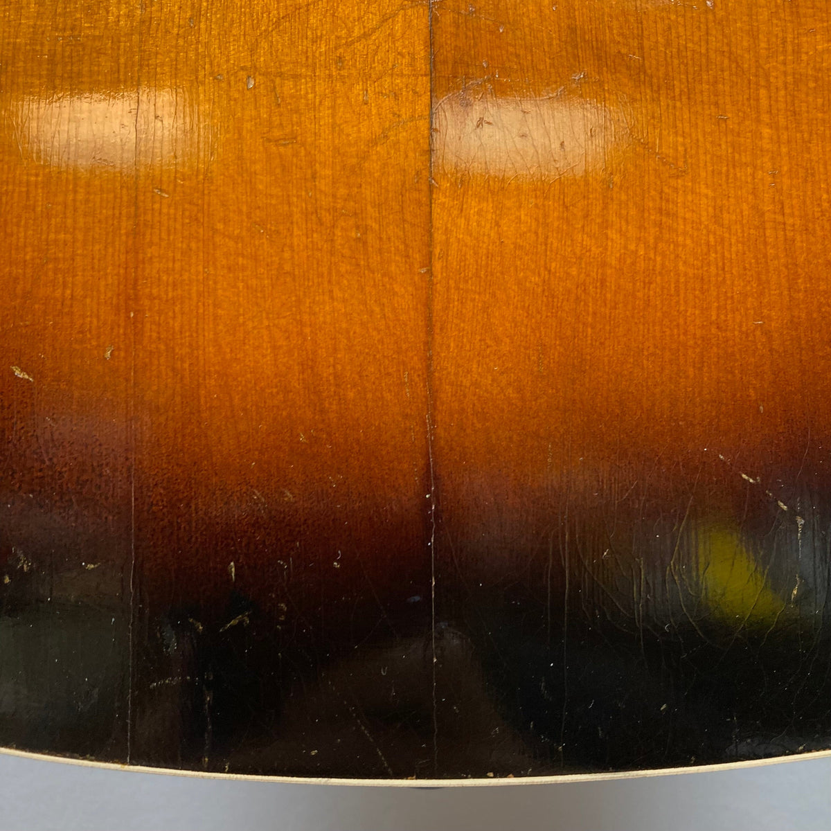 Kalamazoo KG-14 1930s-1940s Sunburst guitar, close-up of restored body showcasing vintage wood and stable neck joint.