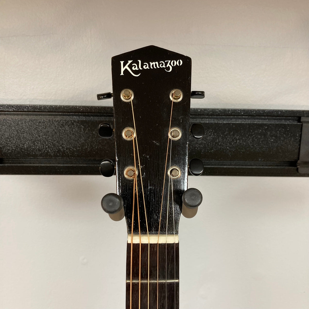 Close-up of the Kalamazoo KG-14 1930s-1940s Sunburst guitar neck and pegs, showcasing the vintage craftsmanship and restored features.