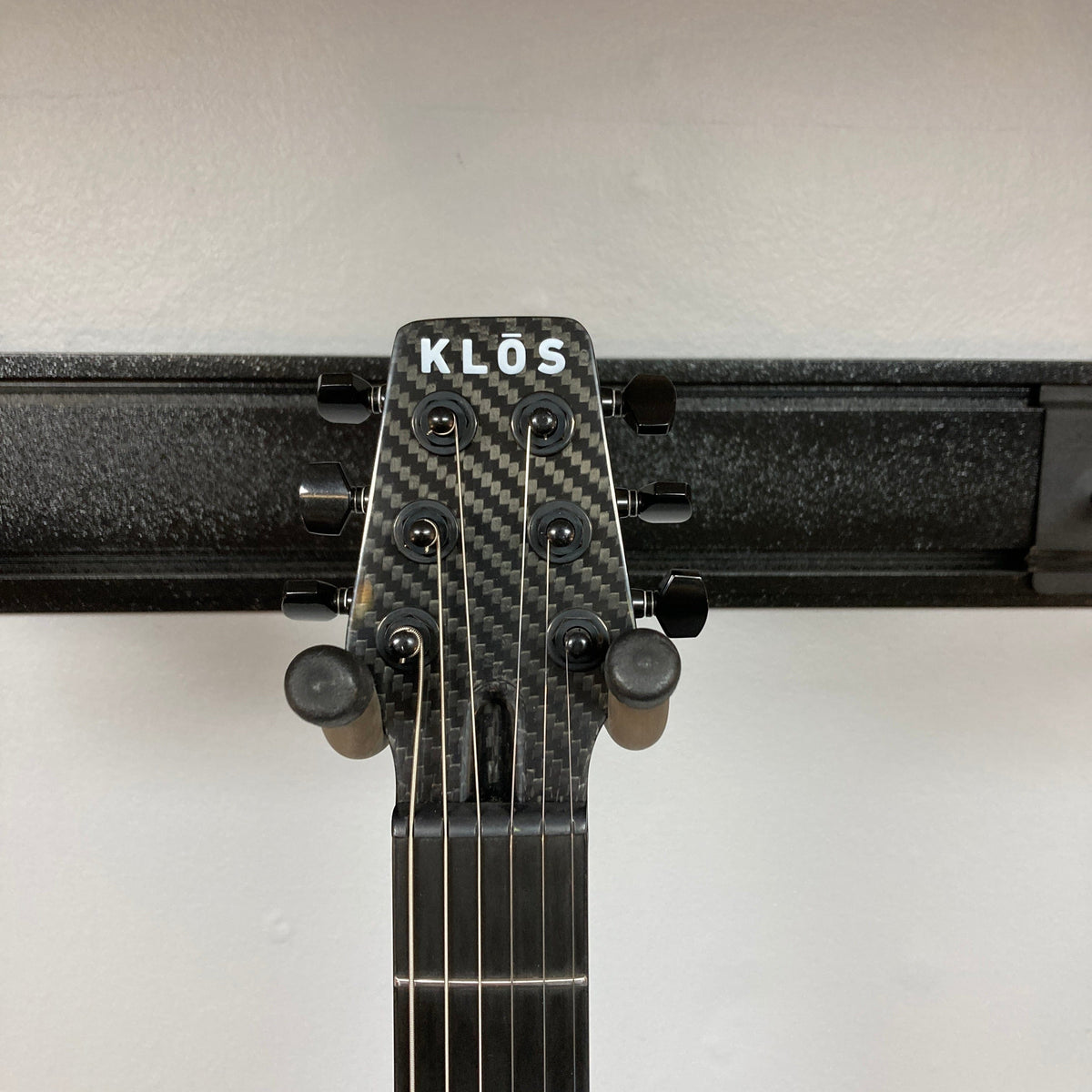 Close-up of the KLOS Apollo Pro Electric Guitar Dark Brown, showcasing the carbon fiber neck and detailed craftsmanship.