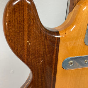 Kramer 650G Deluxe 1986 guitar's neck close-up, showcasing vintage craftsmanship and metal plate with screw detail.