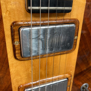 Close-up of Kramer 650G Deluxe 1986 guitar, highlighting strings and craftsmanship.