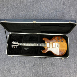 Kramer 650G Deluxe 1986 electric guitar in case, showcasing vintage craftsmanship and electrifying tone.