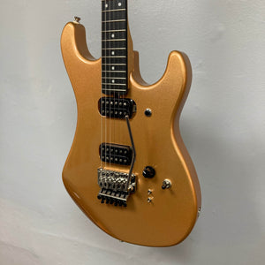 A Kramer 84 HH Killswitch electric guitar in Smoked Almond Metallic with a dark fretboard, dual humbuckers, Floyd Rose tremolo, and control knobs is shown against a plain light gray background. Gigbag included.
