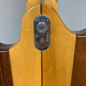 Kramer DMZ 6000-G Natural guitar close-up, showcasing aluminum neck with wooden inlay, maple body, and dual DiMarzio pickups.