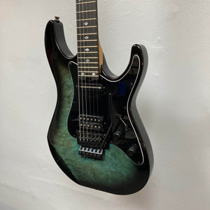 Black burst electric guitar with a gradient finish on a light gray background