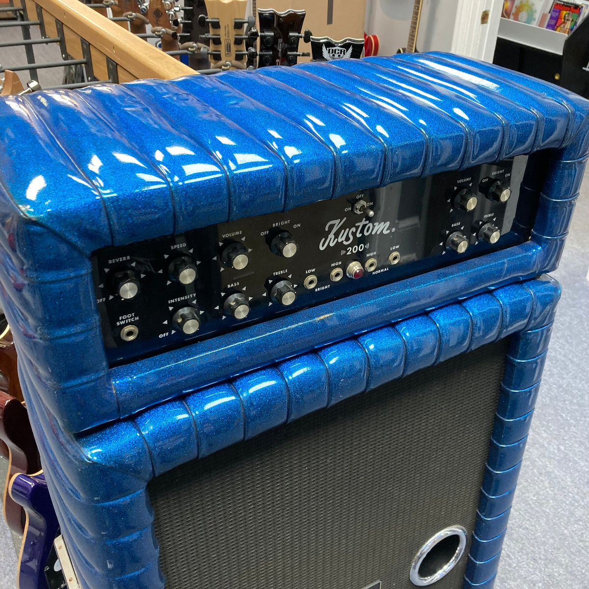 Kustom K200-B2 Blue Head and Cabinet Amp with knobs for tone control.