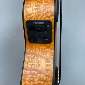 Luna Bari-Bass Quilt Ash Top Bass Ukulele with Preamp and gigbag, close-up showing detailed wood grain and Fishman Clasica II preamp system.