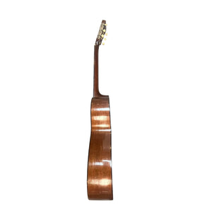Side view of a Martin 00-18G Classical Guitar (c. 1961–1962) with a wooden finish and gold tuning pegs, set against a plain white background.