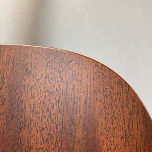 Martin D-15M acoustic guitar close-up, showcasing its solid mahogany construction and fine wood grain details.