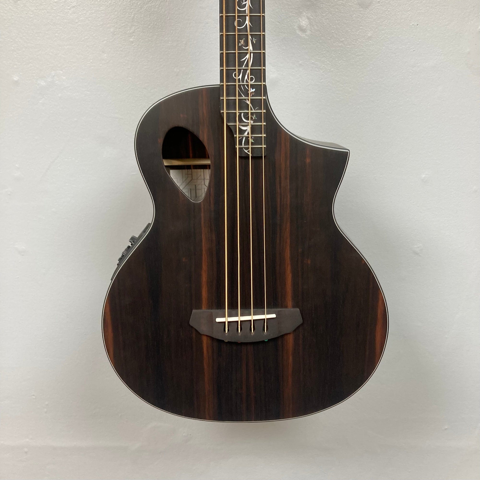 Close-up of the Michael Kelly Dragonfly 4 Slim Forte Port 3/4 Bass Prototype, showcasing the intricate Dragonfly inlay on the fretboard.