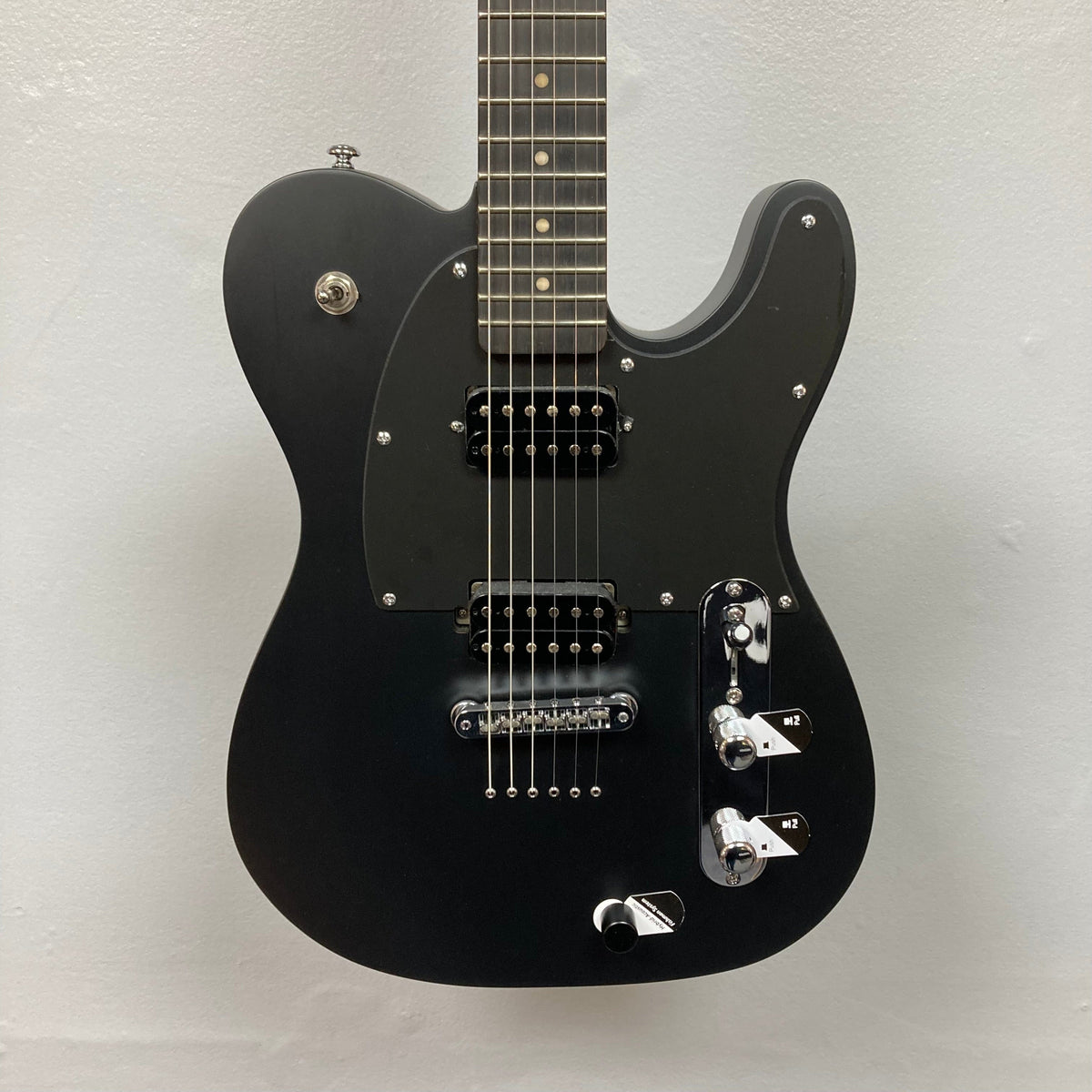 Michael Kelly Hybrid 55T Black Satin Blem electric guitar with silver knobs and Rockfield pickups, showcasing versatile tones and a sleek design.