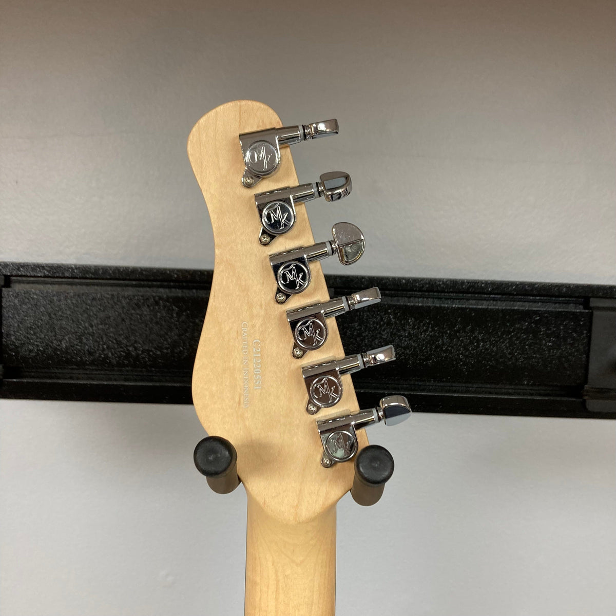 Michael Kelly Hybrid 55T Black Satin Blem with Rockfield humbuckers, Fishman Powerbridge, and ebony fretboard, showcasing guitar neck, pegs, and close-up logo detailing.