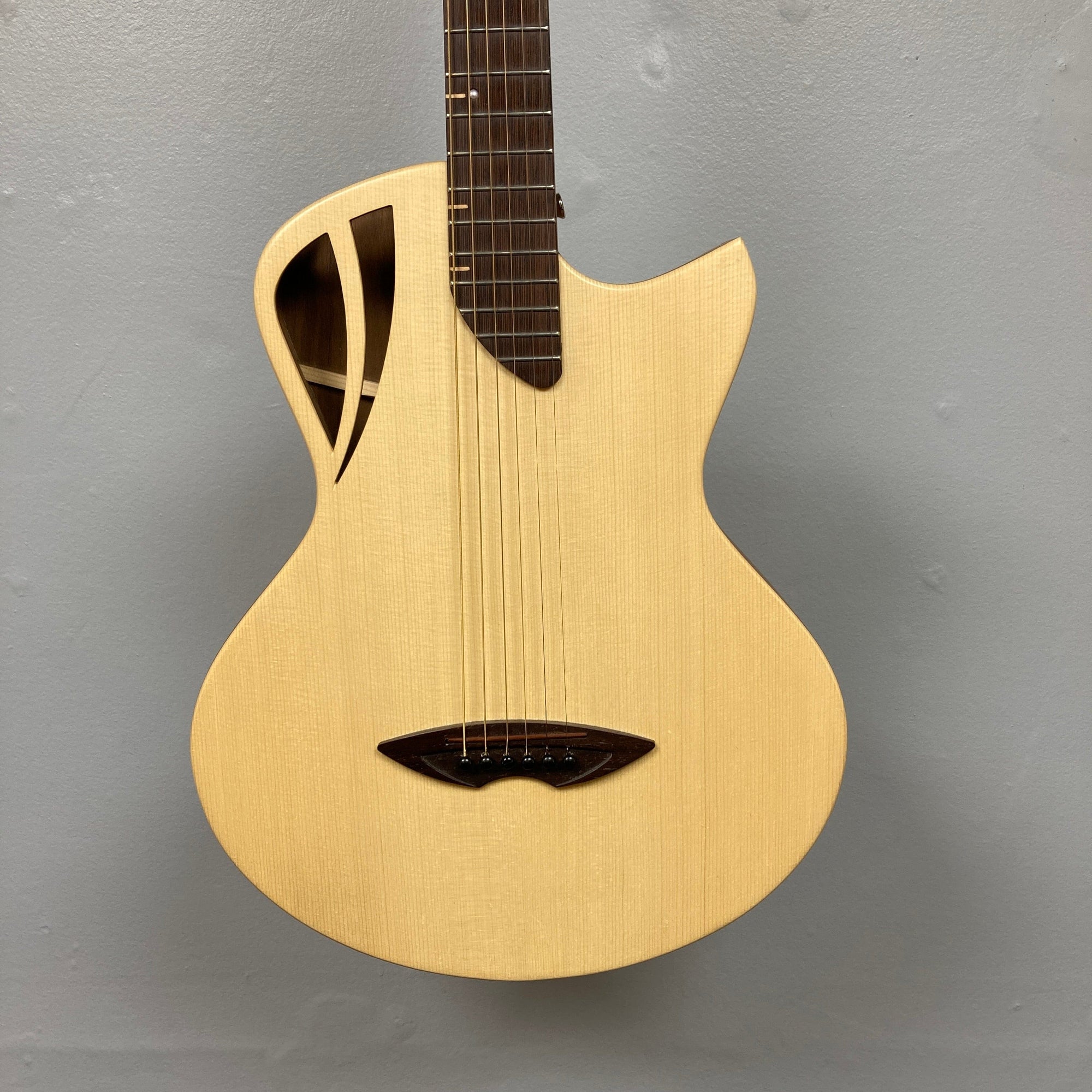 Murray Kuun Coupe Natural Acoustic Guitar, detailed close-up showcasing strings and craftsmanship, perfect for music enthusiasts seeking quality instruments from Guitars on Main.