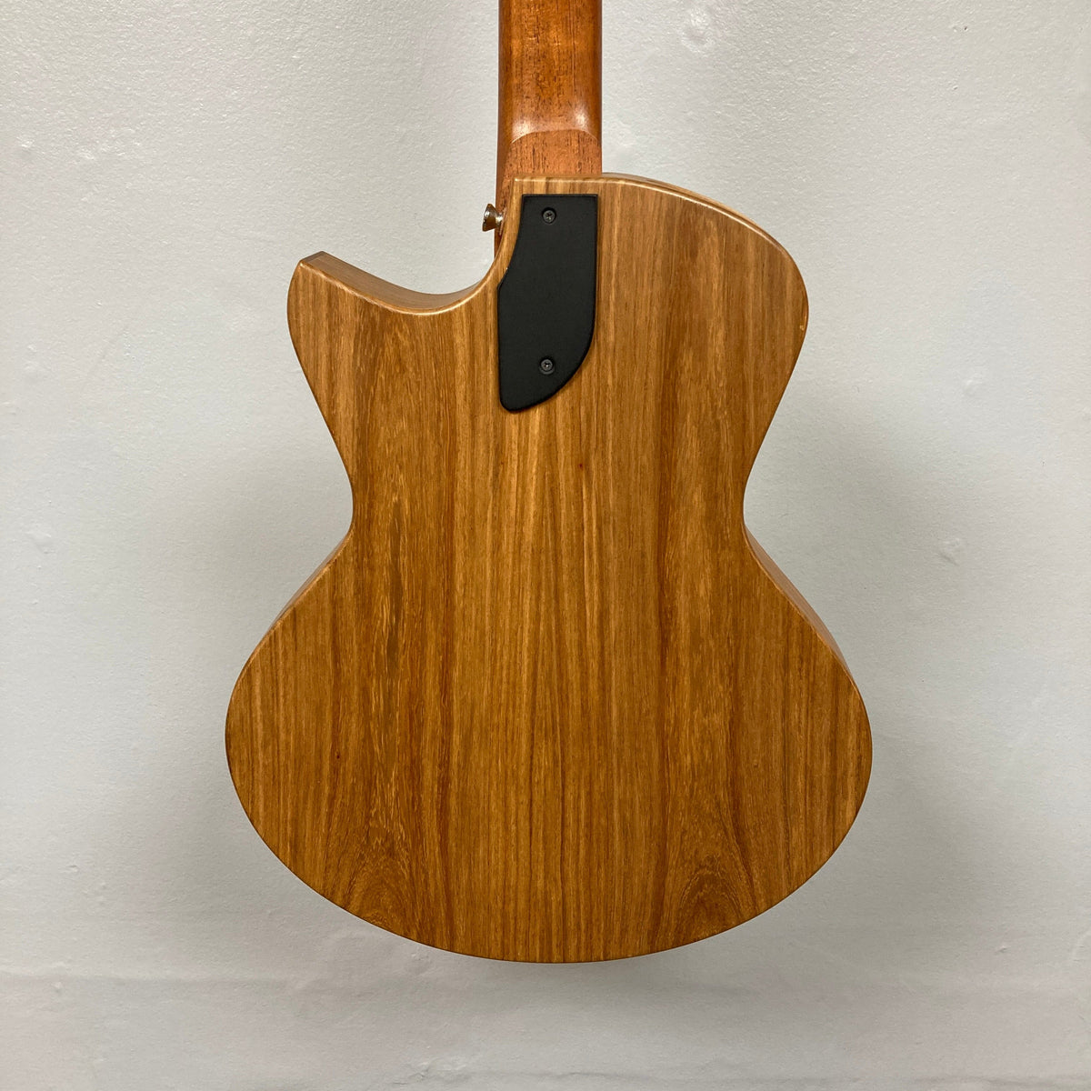 Close-up of the Murray Kuun Coupe Natural Acoustic Guitar, highlighting its wooden craftsmanship and string details, perfect for music enthusiasts.