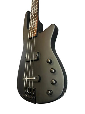 Close-up of the NS Design Wav Radius Bass w/NS Gigbag in matte black, highlighting its four strings, control knobs, and part of the fretboard—designed by NS Design for punchy bass tones against a white background.