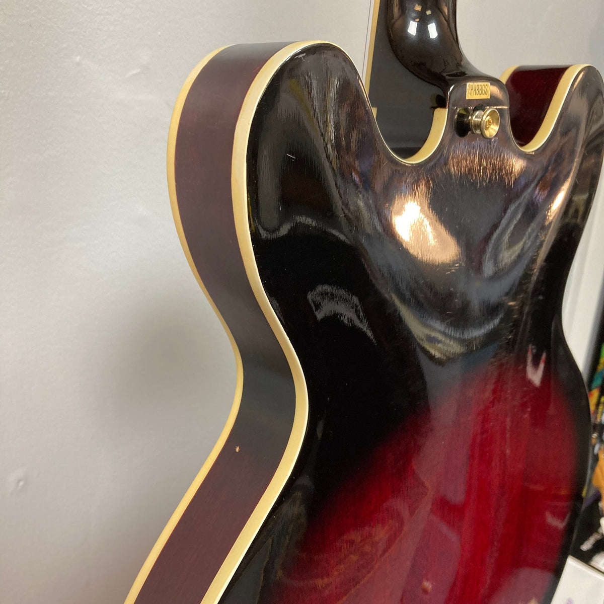 Close-up of a Palmer Semi-hollow 1970-80s ES-335 guitar showcasing the body, f-holes, and dual humbucker pickups.