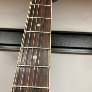 Close-up of a Palmer Semi-hollow 1970-80s ES-335 guitar neck, showcasing vintage craftsmanship and dual humbucker pickups, highlighting the instrument's quality and playability.