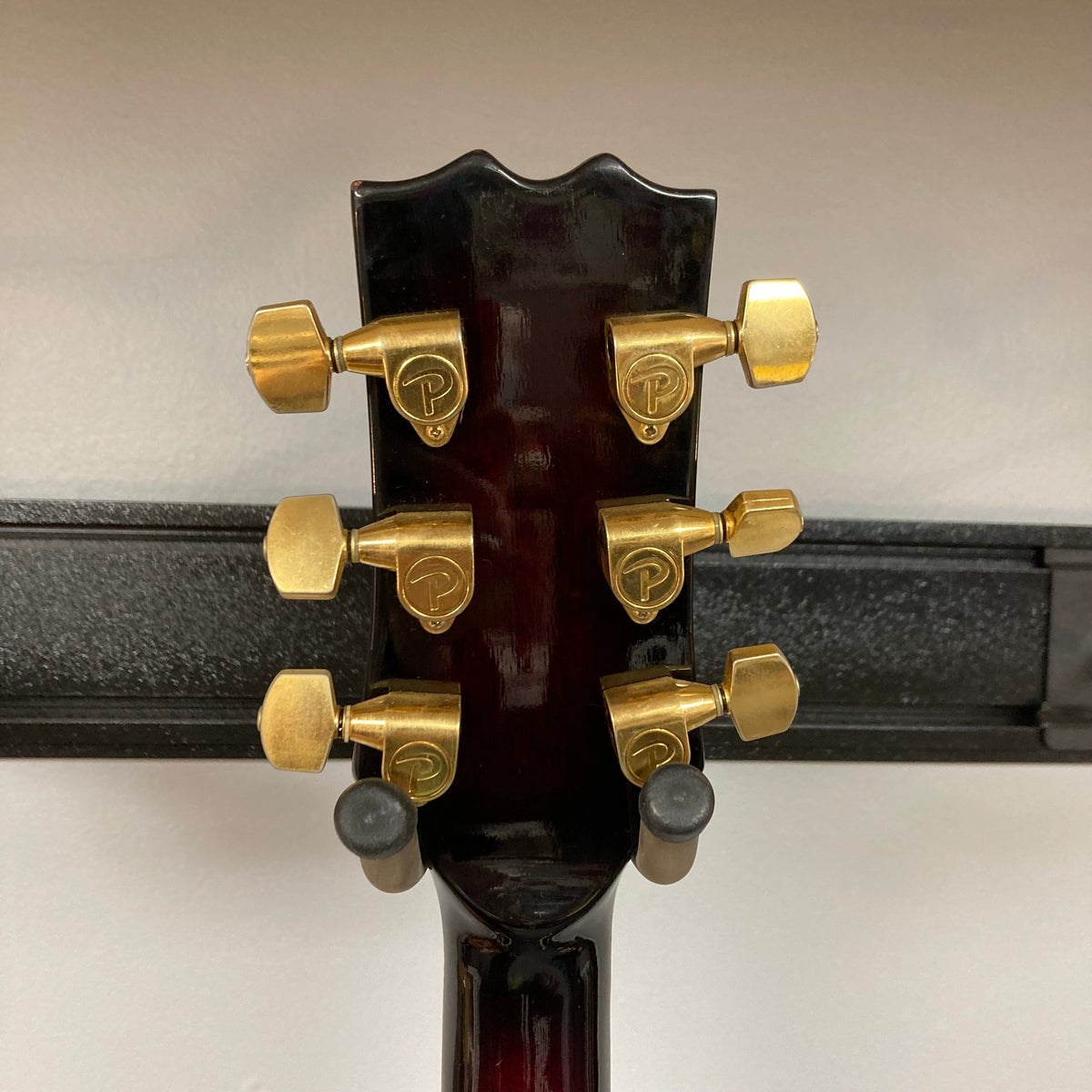 Palmer Semi-hollow 1970-80s ES-335 guitar close-up, showcasing vintage hardware and craftsmanship with visible f-holes and dual humbucker pickups.