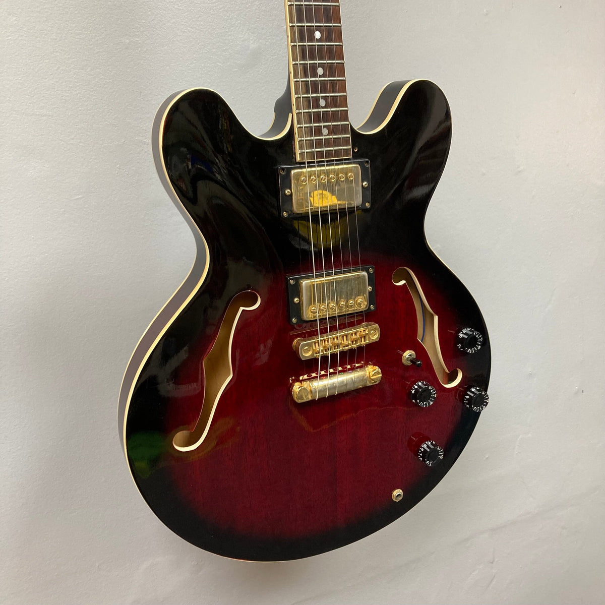 Palmer Semi-hollow 1970-80s ES-335 electric guitar, close-up of strings and body, showcasing vintage craftsmanship with dual humbuckers and f-holes.