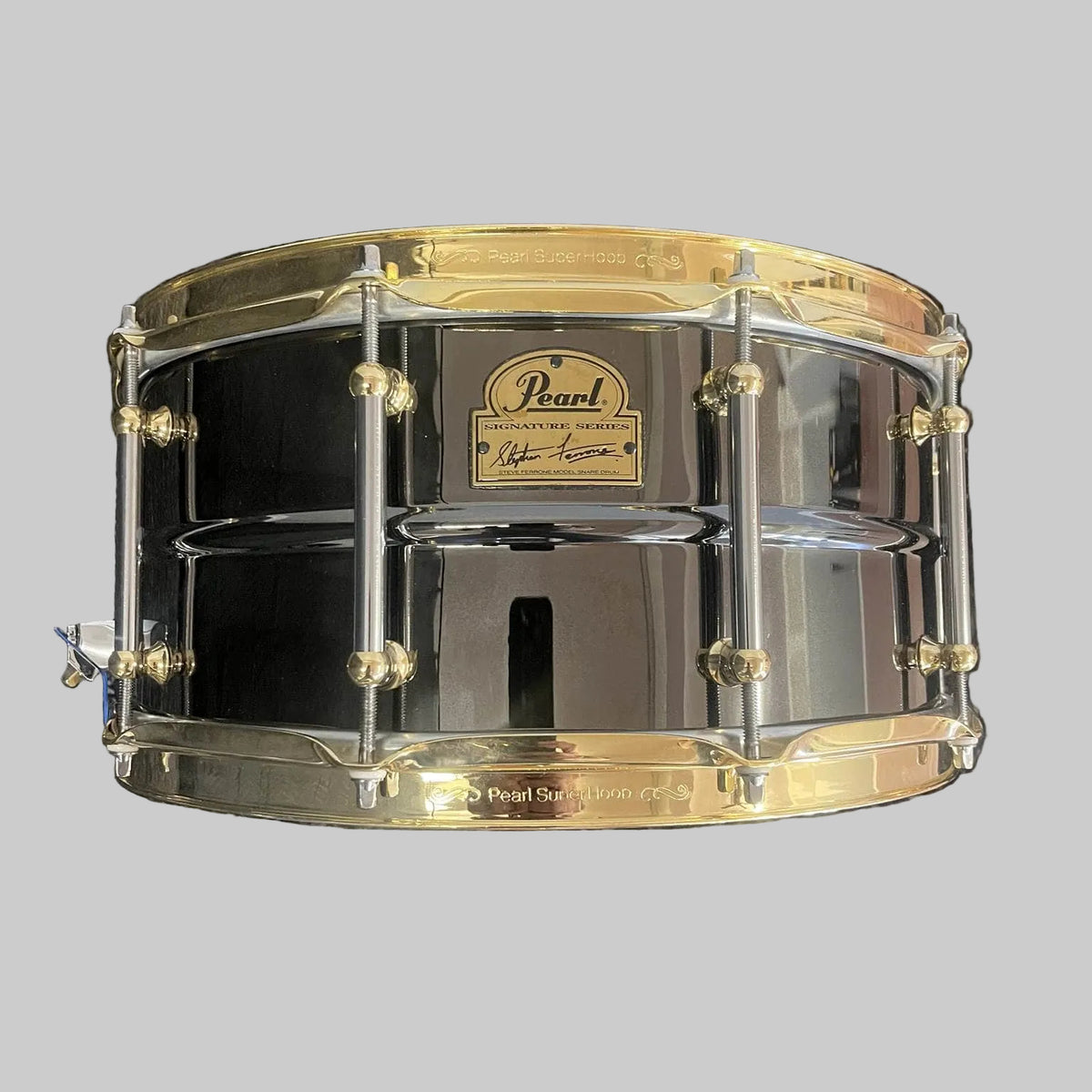 Pearl Steve Ferrone Signature Series snare drum with black nickel shell and gold hardware