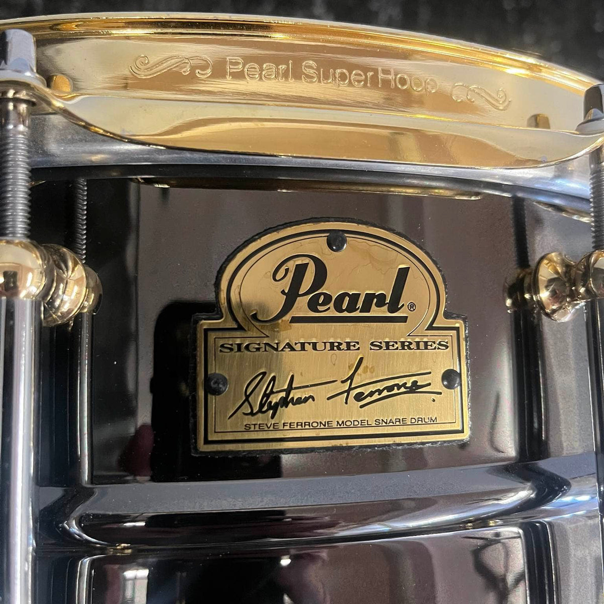 Pearl Steve Ferrone Signature Series snare drum with black nickel shell and gold hardware