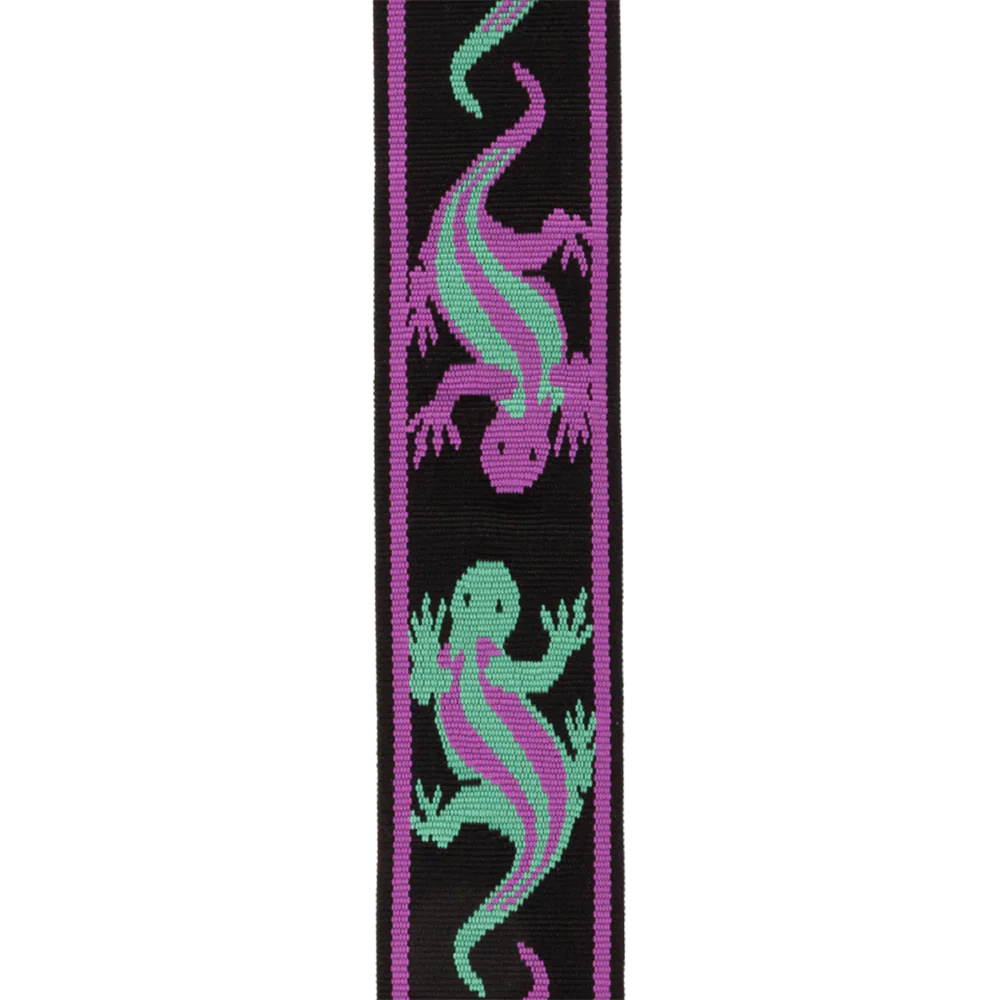 The Planet Waves Auto Lock Guitar Strap features green and purple lizard designs on a black and purple strap, with a plastic buckle and eyelet—ideal for fans of unique guitar accessories.