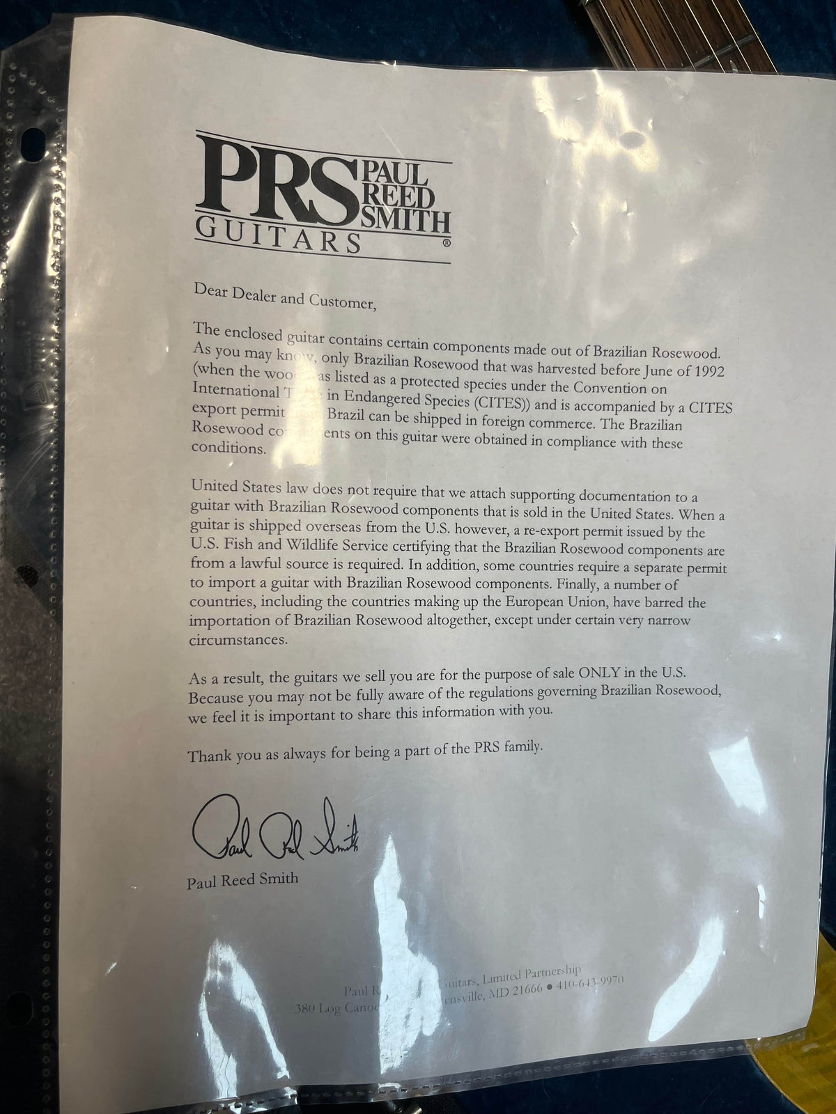 A letter from PRS explains the use of Brazilian Rosewood in guitars like the PRS P22 Artisan Piezo Green Fade 2013 and outlines legal restrictions on its distribution and sale in the U.S.