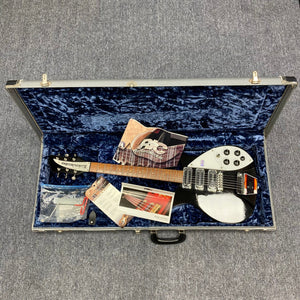 Rickenbacker 325C64 Jetglo guitar in case with brochures, highlighting '60s rock legacy and craftsmanship.