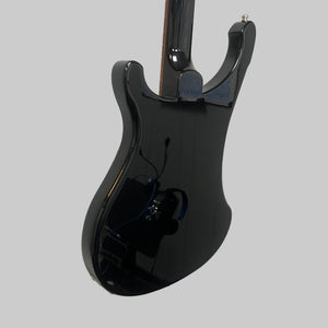 A black electric guitar is mounted on a white wall next to a red electric guitar, while a vintage bass guitar—like the Rickenbacker 4003 Bass Guitar – 2020 Jetglo w/Case by Rickenbacker—completes the striking display.