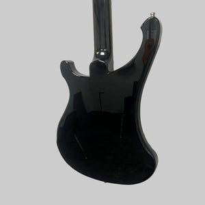 A Rickenbacker 4003 Bass Guitar – 2020 Jetglo w/Case by Rickenbacker is hanging on a white wall, photographed from the back to showcase its glossy black finish and the reflections of the room.