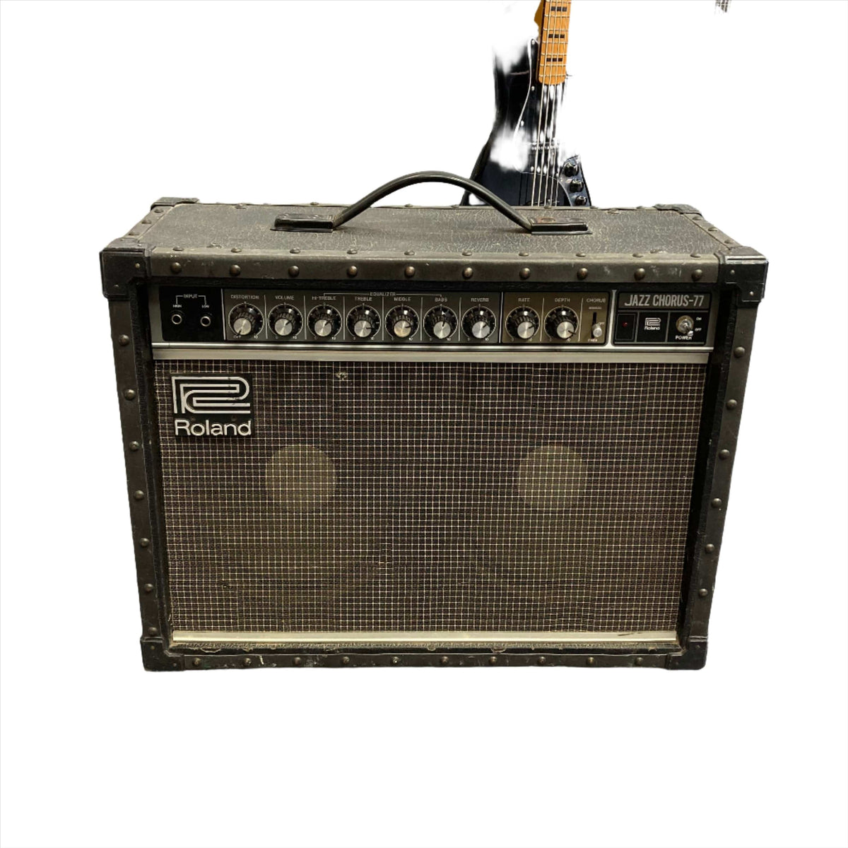 Roland JC-77 Jazz Chorus 2x10 Guitar Combo Amp USED, featuring buttons, knobs, and dual speakers for rich, versatile sound.