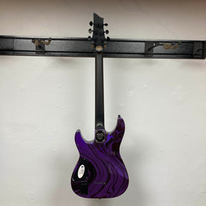 Back view of a Schecter C-1 Hydro-Dip Purple Obsidian electric guitar with a purple and black marbled finish, hanging from a wall-mounted rack.