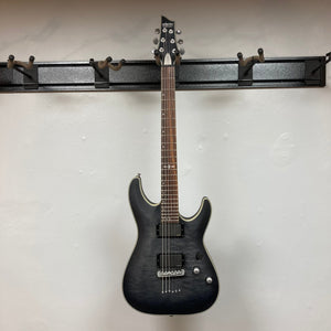 Schecter C-1 Platinum Translucent Black Used electric guitar with quilted maple top and rosewood fretboard, featuring EMG Active 81/85 pickups and platinum inlays.